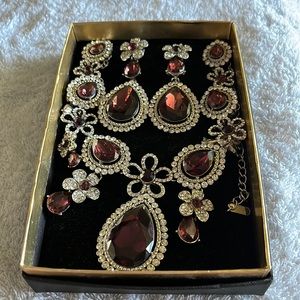 Burgundy and silver earring and necklace set.